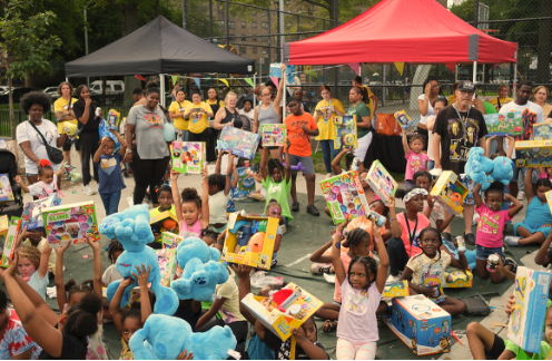 Crowd of kids outside with new toys